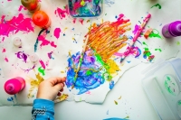child finger painting