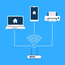 Computers and Wifi graphic depicting a wifi source branching out into a laptop, phone, and printer