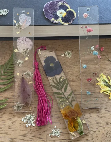 Clear resin bookmarks with dried flowers in them. 