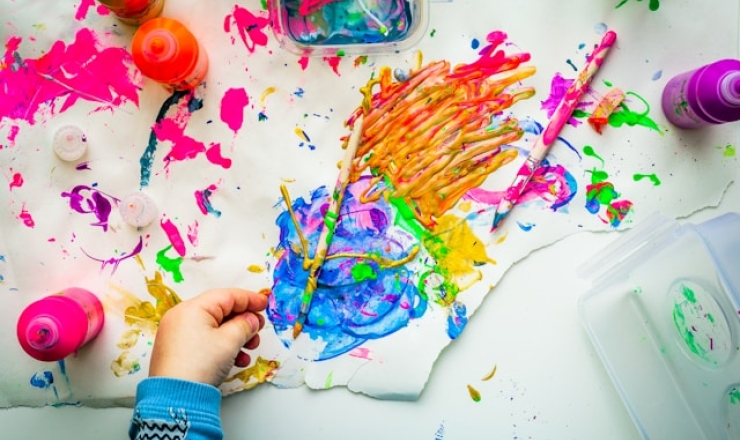 child finger painting